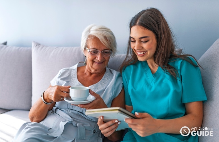 social service assistant reading a book to a patient