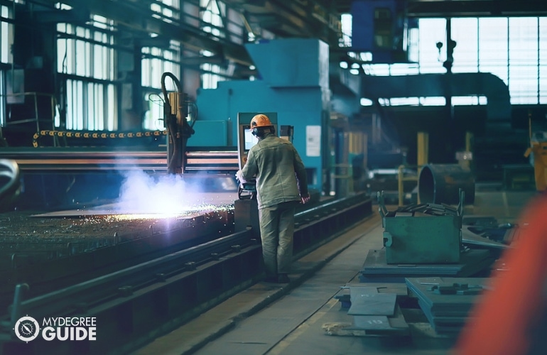 Metallurgic Engineer casting metals in a plant