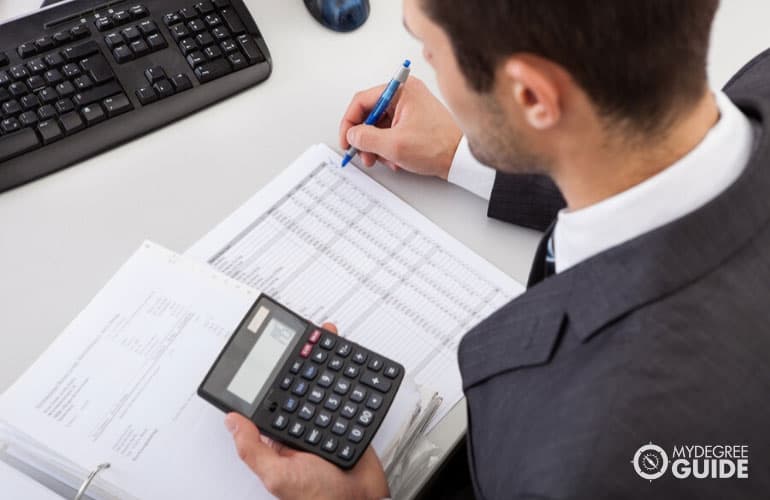 male accountant calculating tax