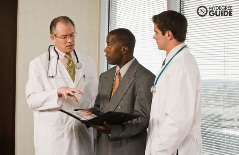 Healthcare Manager talking to doctors