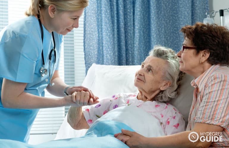 female nurse taking care of elderly patient