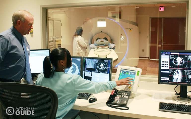 healthcare administrator using CT scan for patient