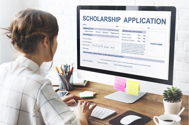 Woman completing scholarship application