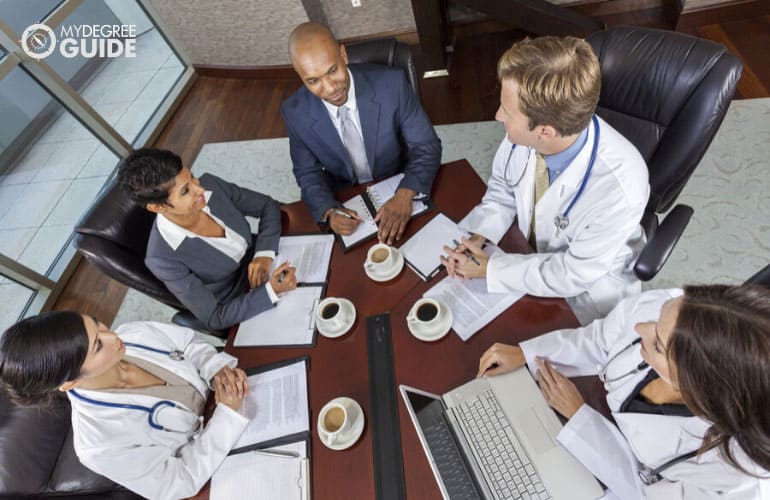 top medical executives in a meeting