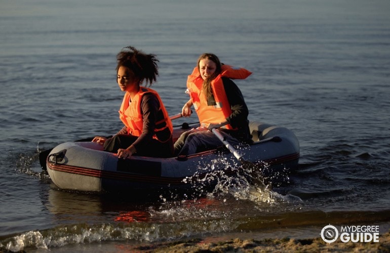 two women on a boat helping the victims during emergency