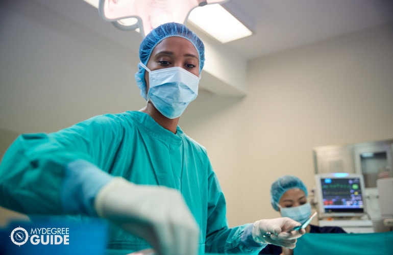nurse anesthetist assisting in operating room