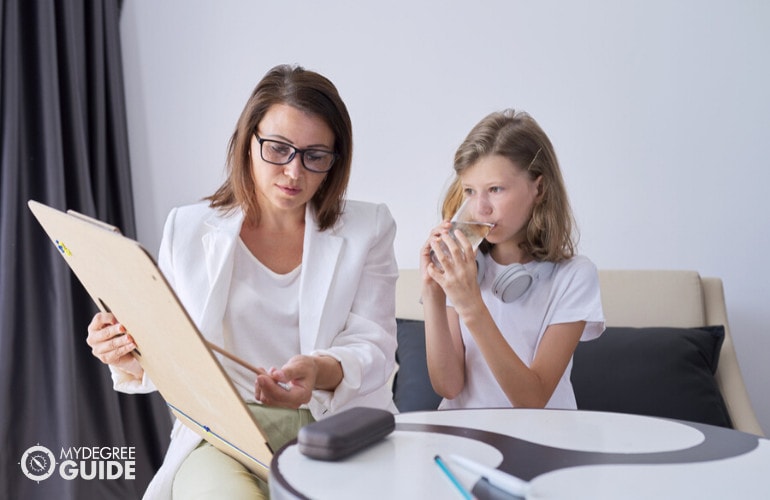 Educational Psychologist with a child