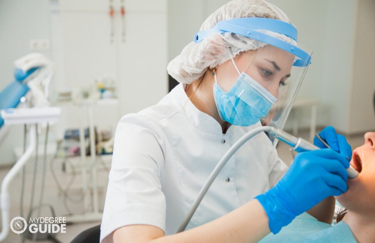 dental hygienist with a patient