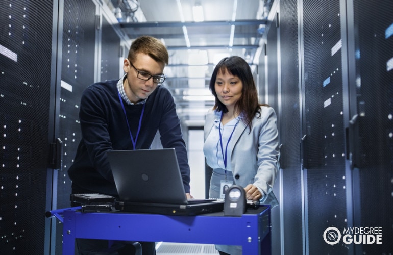 Two Information Security Analysts working in data center