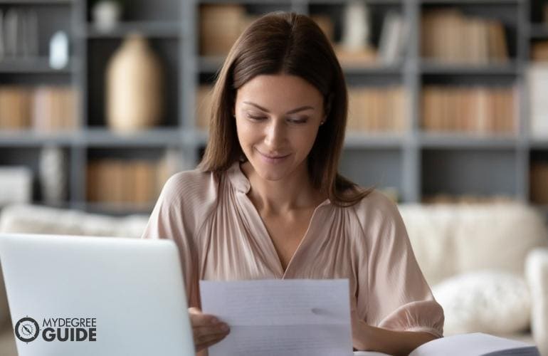 Woman preparing requirements for Compliance Master