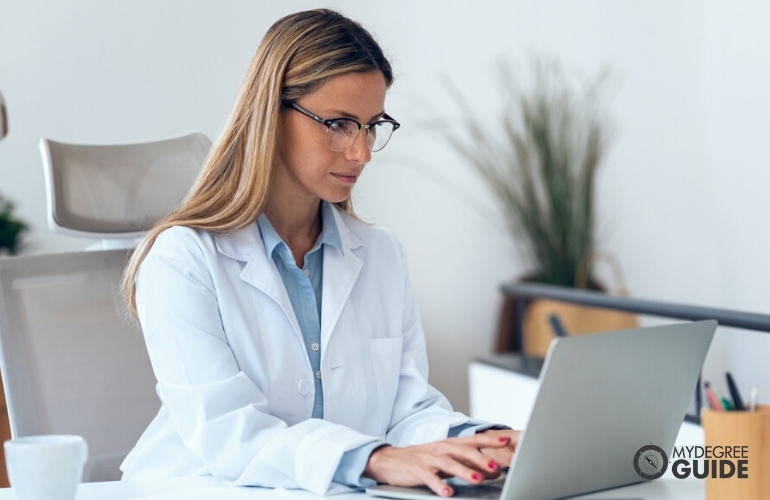 Woman taking Online Healthcare Analytics Certificate 