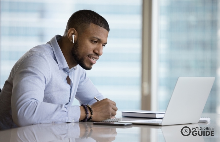 Man taking Online Masters in Integrative Health