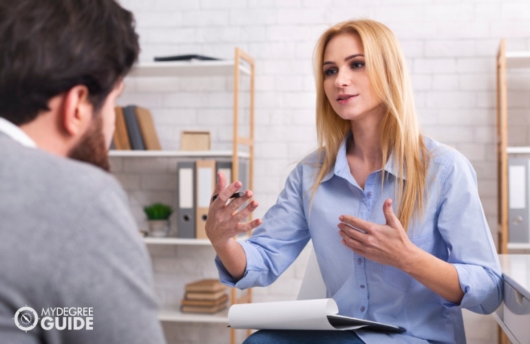 Mental Health Counselor, discussing with a patient
