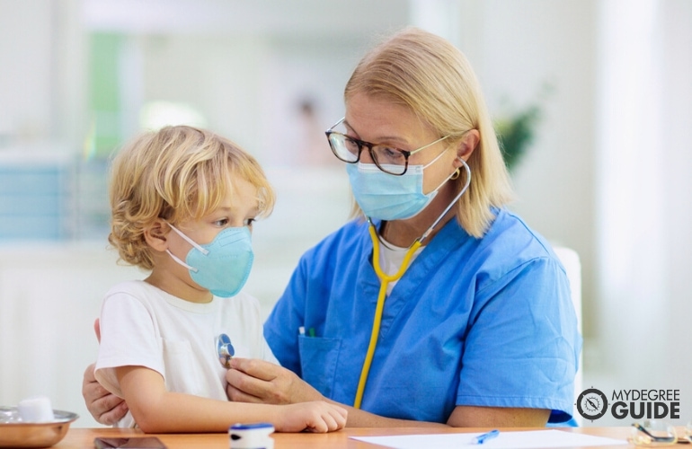 Family nurse assessing a child