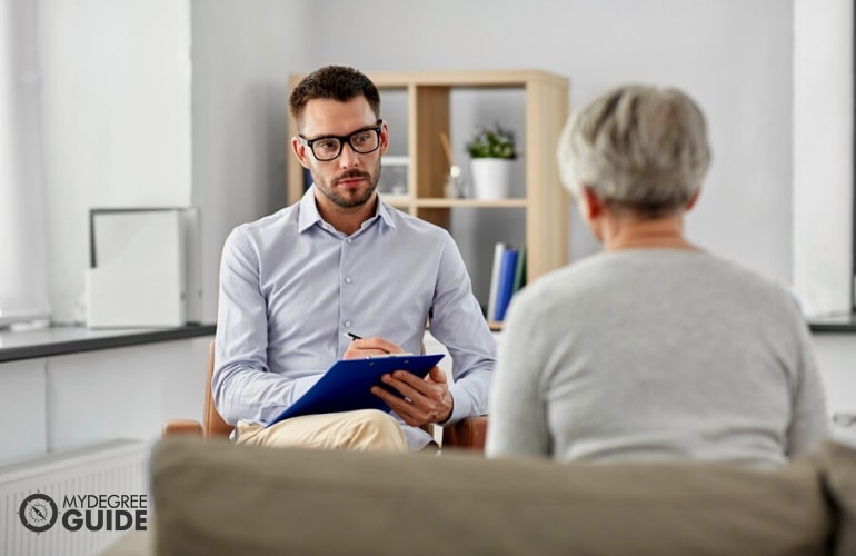 Mental Health Counselor in a session with elderly client