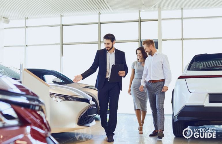 Sales Manager showing cars to clients