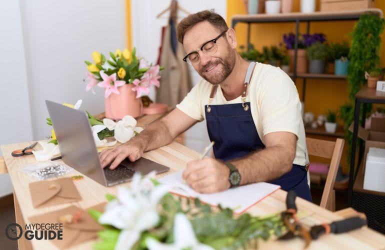 Man preparing requirements for Certificate in Floral Design 