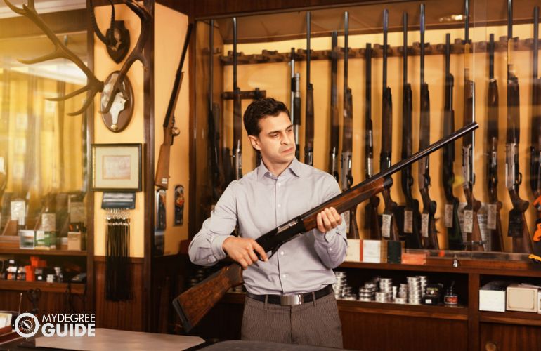 Gunsmith with FFL working in his gun shop