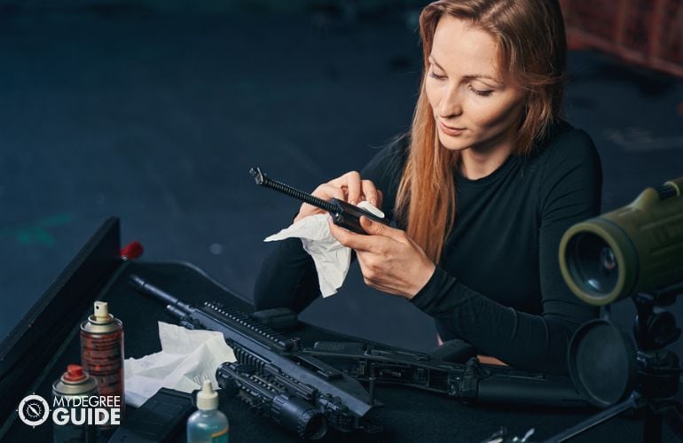 Woman specialized in custom gunsmiths