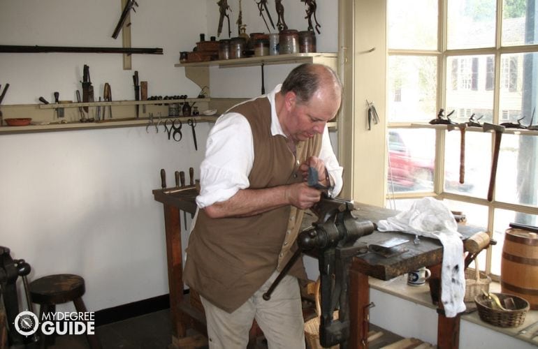 Gunsmith renovating historical firearm
