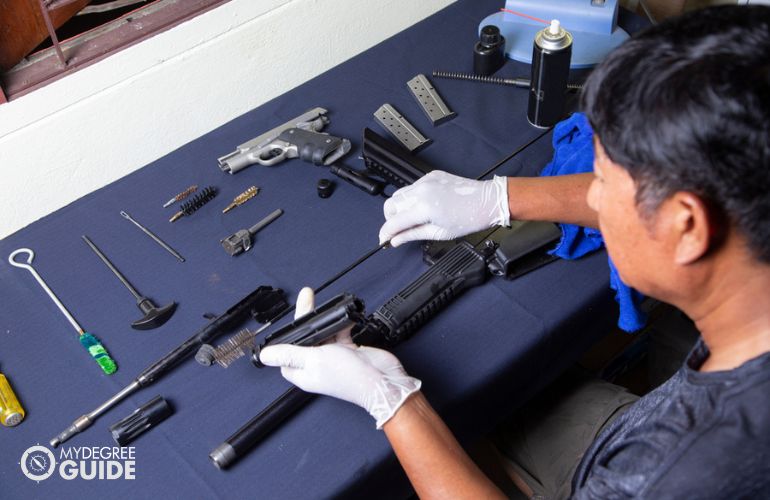 Gunsmith repairing a firearm