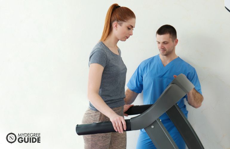 Occupational Therapist assisting patient on posture and exercises