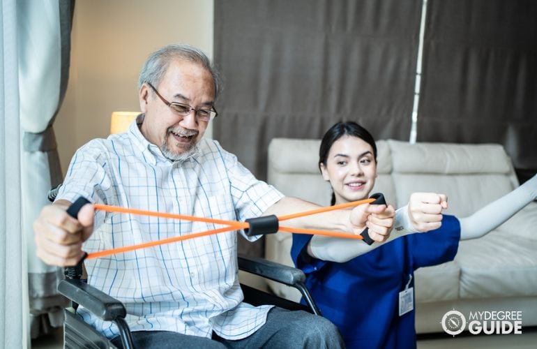 Occupational Therapist guiding a patient with light exercises