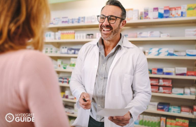 Licensed pharmacist discussing prescription with patient