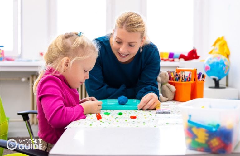 Recreational Therapist in a session with a child