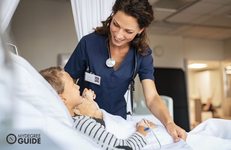 Registered Nurse checking on a young patient