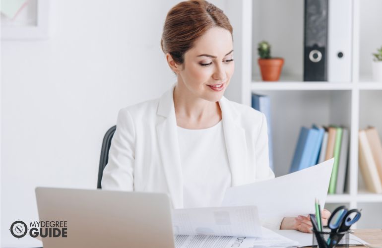 Woman preparing requirements for Financial Management Bachelor's