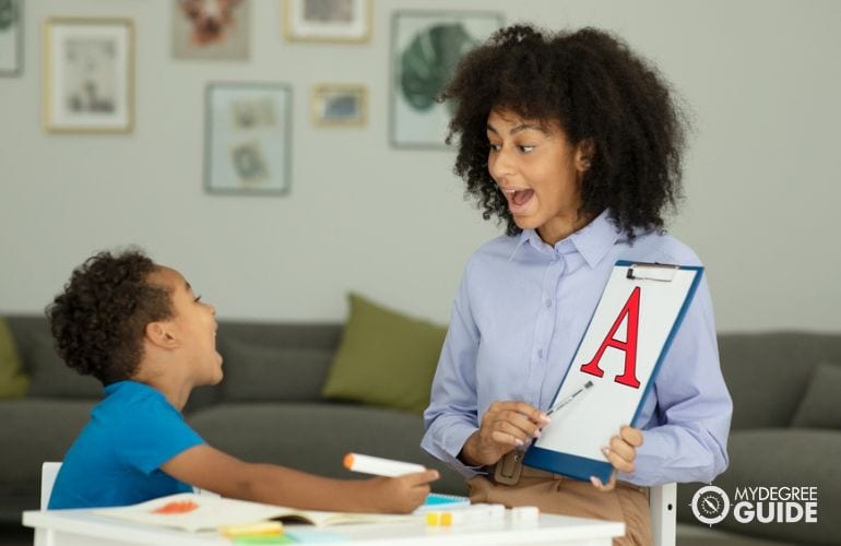 Speech-Language Pathologist in a session with a child