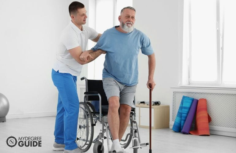 Physical Therapist guiding an injured patient with basic movements