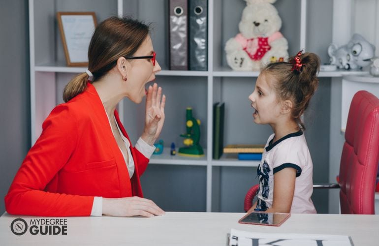 Speech-Language Pathologist conducting speech therapy with a child