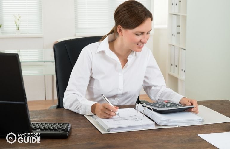 accounting clerk updating financial records 
