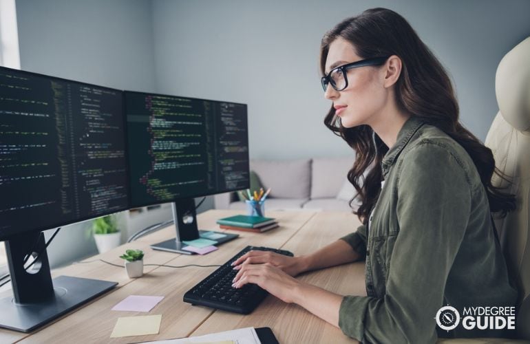 Woman taking Online Masters in Software Development