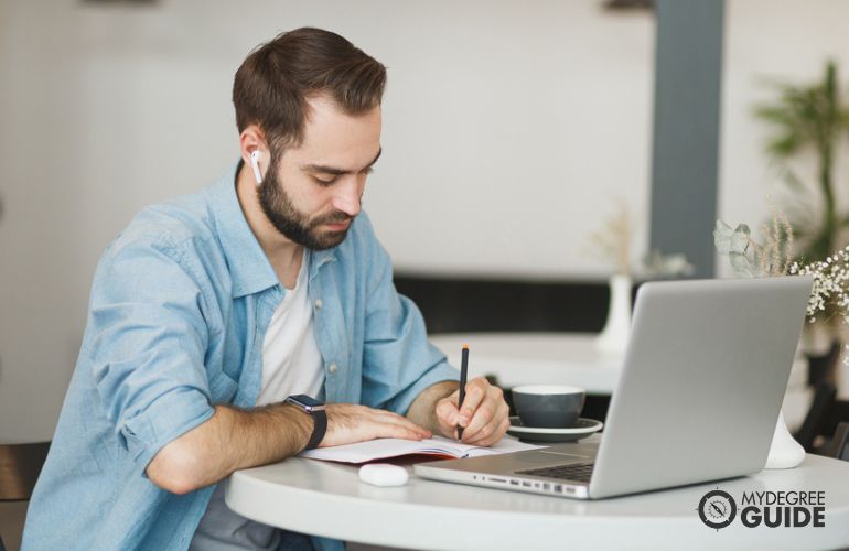 Man pursuing Online Professional Writing degree