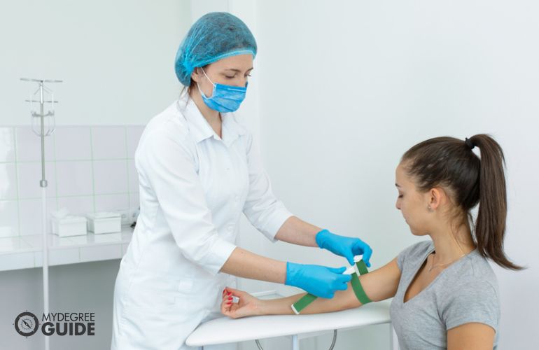 Phlebotomy Technician taking a patient's blood