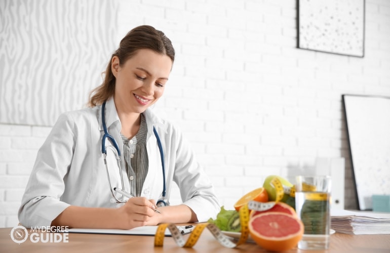 clinical dietitian working in her clinic