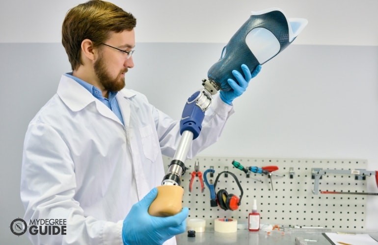 Prosthetist designing an artificial limb