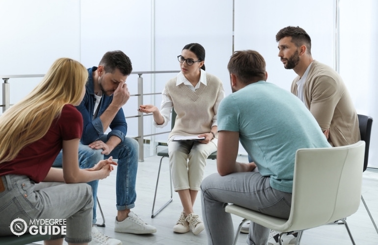 Addictions Psychologist conducting a group therapy