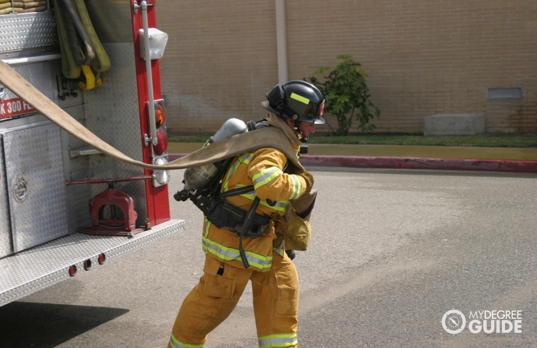 firefighter saving a child from a fire
