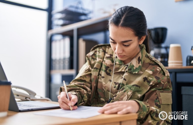 student getting her college degree while in the military