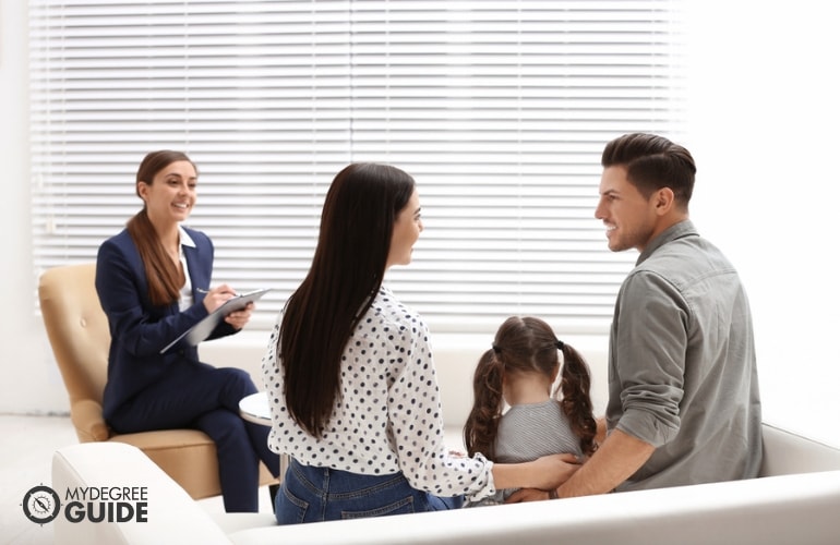 psychologist having a therapy session with a family